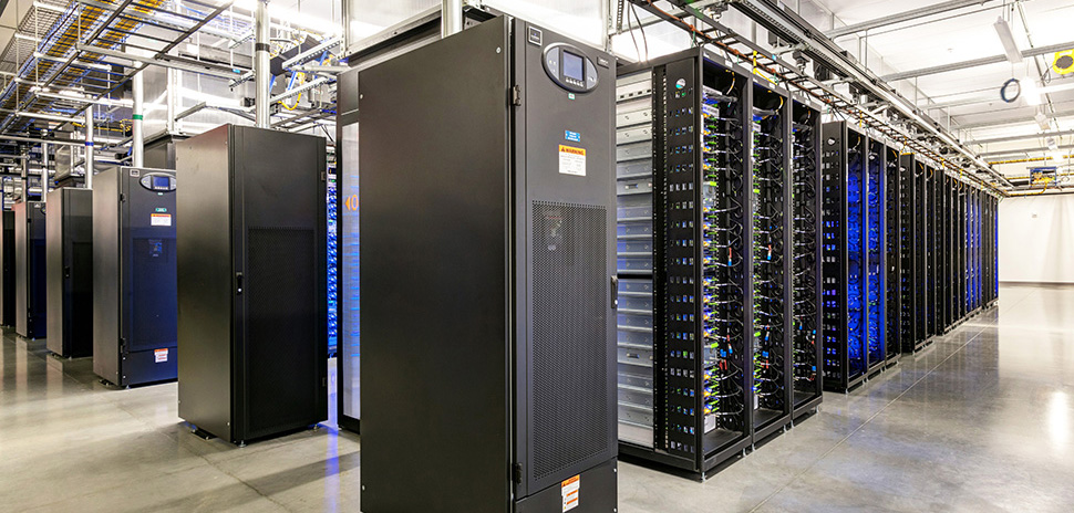 A large data center room filled with rows of servers, showcasing advanced technology and infrastructure.